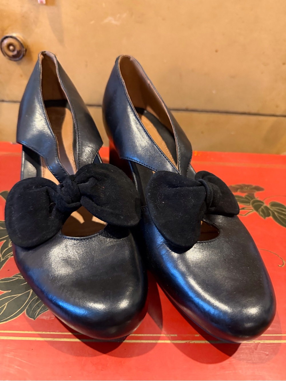 Black leather Earthies with suede bow